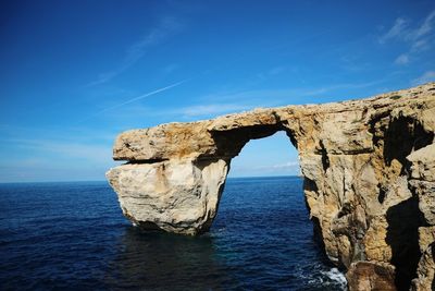 Scenic view of sea against blue sky