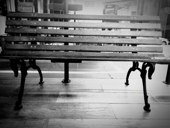 Close-up of benches sitting on bench