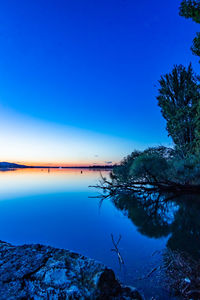 Scenic view of sea against blue sky