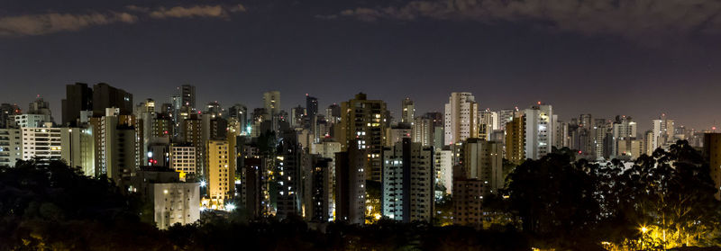 Illuminated buildings in sao paulo city, brazil,  against sky at night