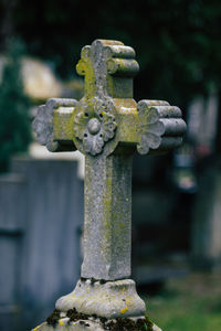 Close-up of cross on stone