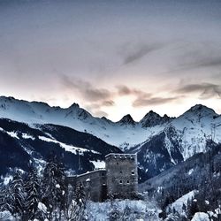 Scenic view of snowcapped mountains against sky during winter