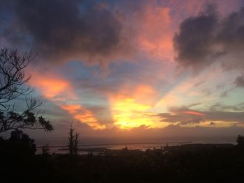 Scenic view of dramatic sky over sea during sunset