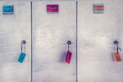 Multi colored keys hanging from lockers