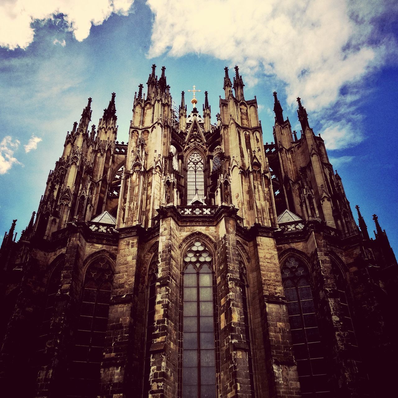 religion, place of worship, low angle view, spirituality, sky, architecture, history, cloud - sky, built structure, travel destinations, day, no people, building exterior, outdoors, ancient civilization