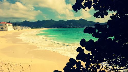 Scenic view of sea against cloudy sky