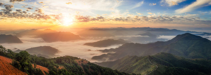 Panoramic view of mountains against sky during sunset