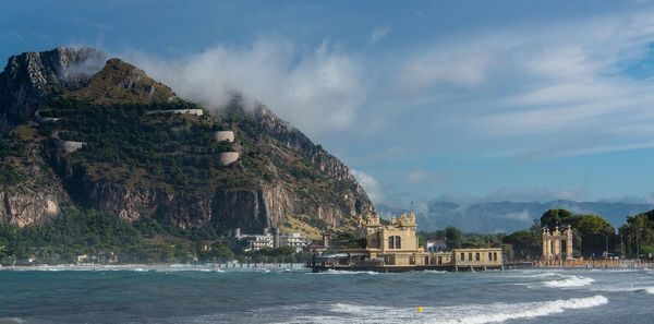 Scenic view of sea against cloudy sky