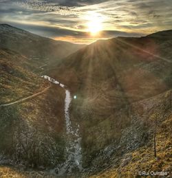 Scenic view of mountains against sky during sunset