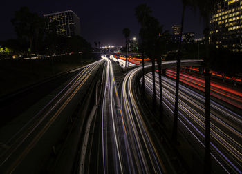 High angle view of light trails on road at night