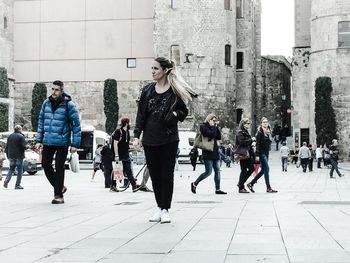 Full length of woman walking in city