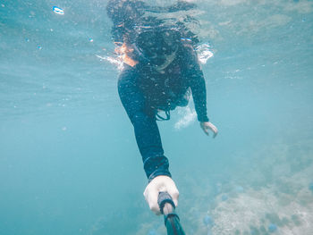 Woman swimming in undersea
