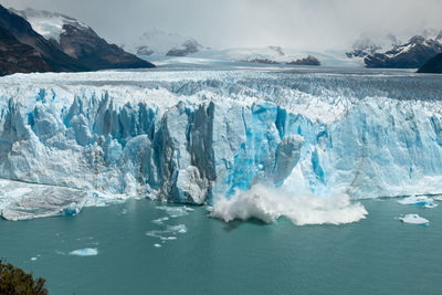 Scenic view of frozen sea against sky