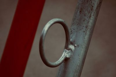 Close-up of metal railing against wall