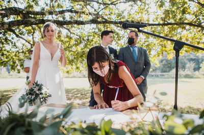 Young couple sitting outdoors