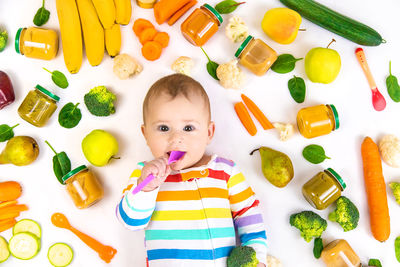 High angle view of cute baby boy playing with toys on table