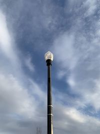 Low angle view of street light against sky