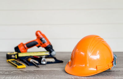 Close-up of construction equipment on table