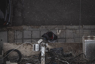 Man with bicycle on wall