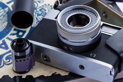 High angle view of old-fashioned camera on table