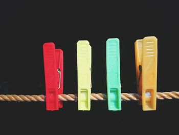 Close-up of multi colored pencils against black background