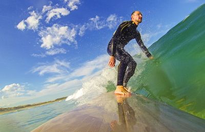 Woman jumping in water