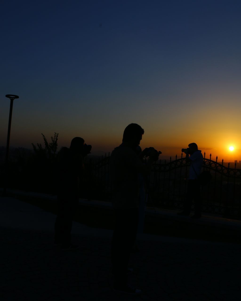 SILHOUETTE PEOPLE AT SUNSET