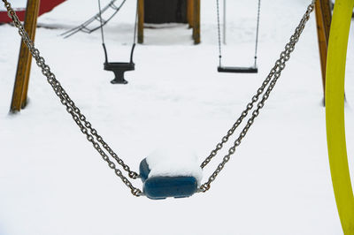 Low angle view of chain against sky