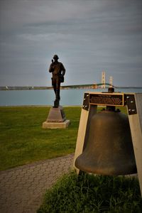 Man standing by sea against sky