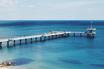 Scenic view of pier on sea against sky