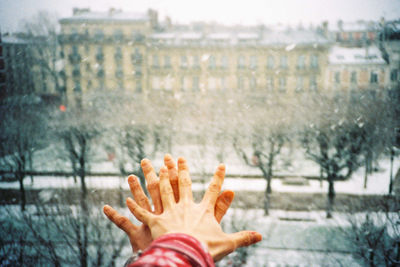 Close-up of hand on snow