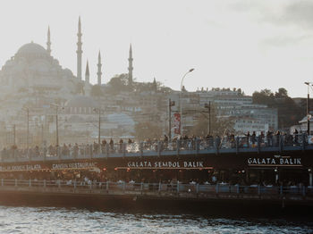 View of cityscape against river