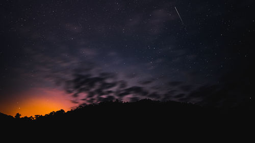 Meteor and star in the night before sunrise