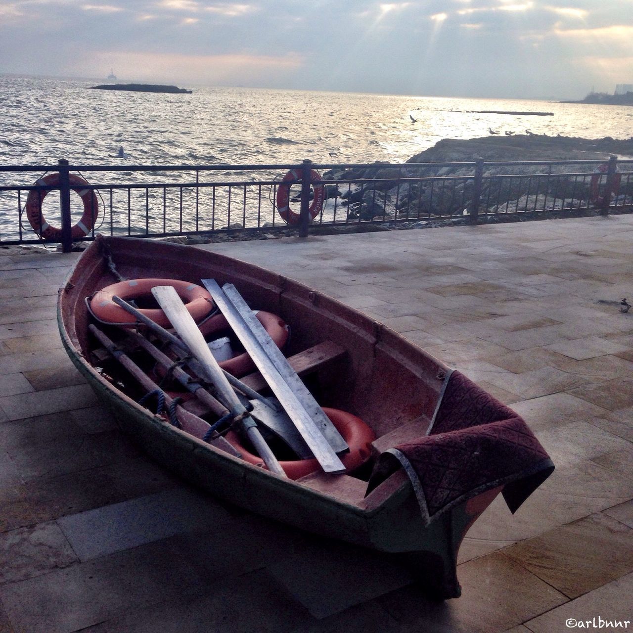 water, sea, transportation, sky, mode of transport, nautical vessel, beach, horizon over water, boat, railing, pier, shore, tranquility, nature, moored, tranquil scene, sunlight, outdoors, bicycle, cloud - sky