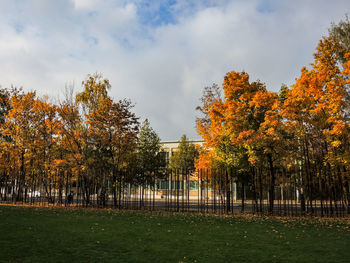 Trees in park during autumn against sky