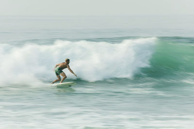 Man surfing in sea