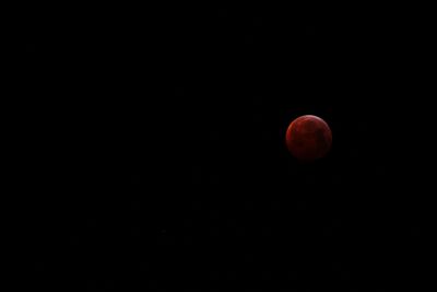 Low angle view of moon against sky at night