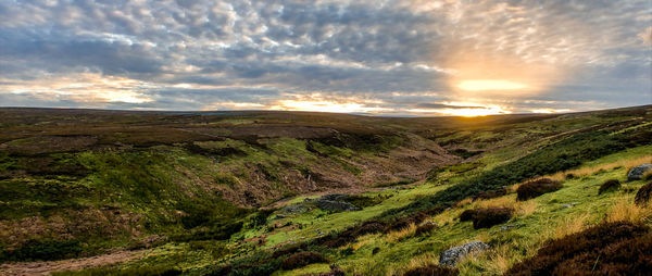 Scenic view of landscape against sky during sunset