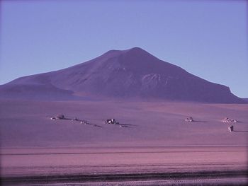 Scenic view of sea with mountains in background