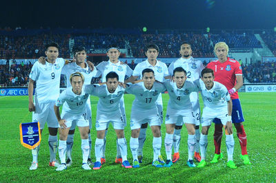 Group of people on soccer field at night