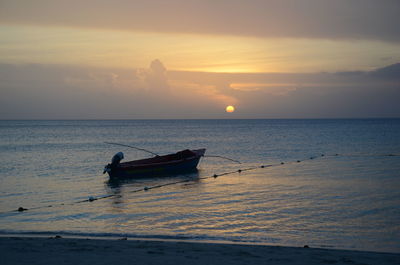 Silhouette of boats at sunset