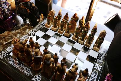 High angle view of chess pieces on table