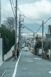 Cars on road against buildings