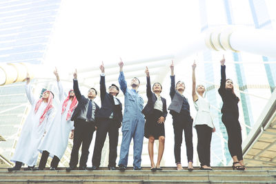 Group of people standing against the wall