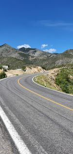 Scenic view of mountain road against sky