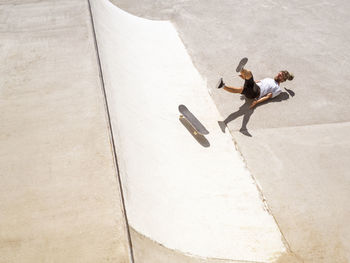 Young man skate boarding in skate park