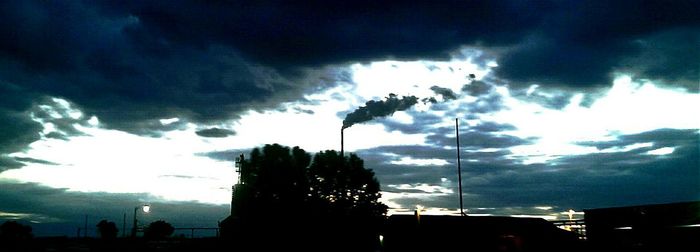 Low angle view of building against cloudy sky