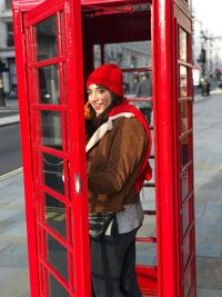 Woman talking on telephone in city