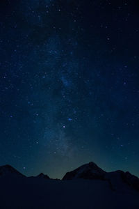 Mountains against star field at night