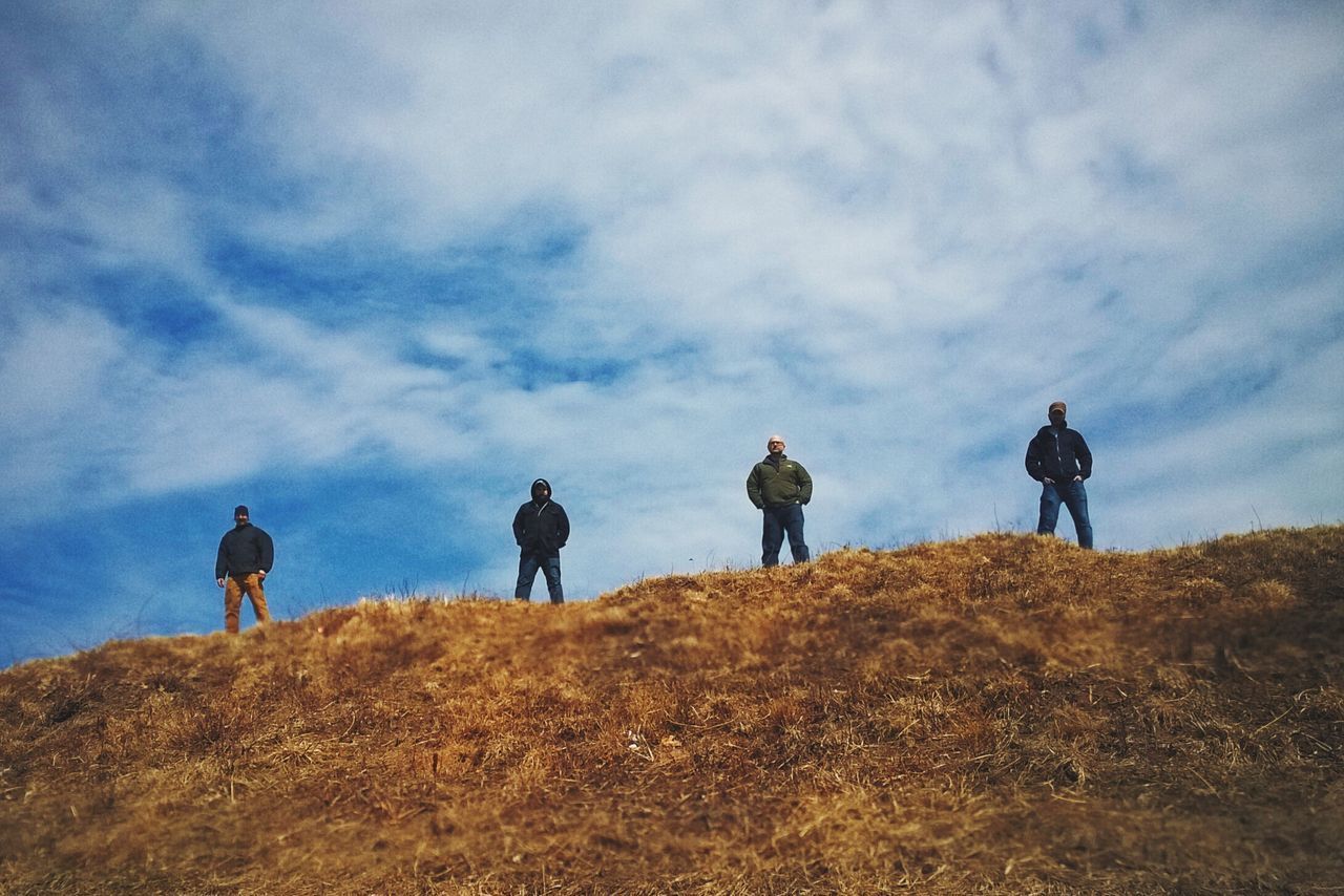 sky, cloud - sky, men, lifestyles, leisure activity, rear view, landscape, standing, togetherness, person, field, cloudy, full length, nature, tranquility, cloud, tranquil scene